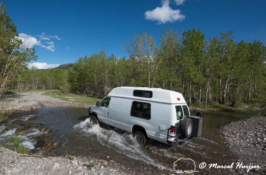 DSC5747 Our Ford E350 4x4 camper van on dirt road, crossing a creek, Montana, USA