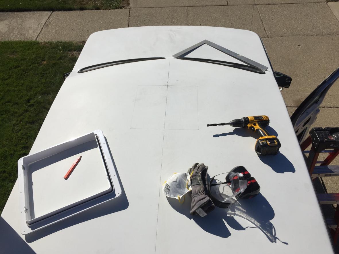 Installing MaxxAir MaxxFan Deluxe. Cut whole in fiberglass hightop roof. Screwed with hex screws with some 1/2 birch plywood for backing. Sealed with Dicor butyl tape and lap sealant.