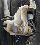 Rear door handle fix - blue arrows point to loose bracket