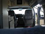 IMG 3475 behind the driver's seat is a unit consisting of the kitchenette with two propane burners, a sink, refrigerator and two closets, a hanging...