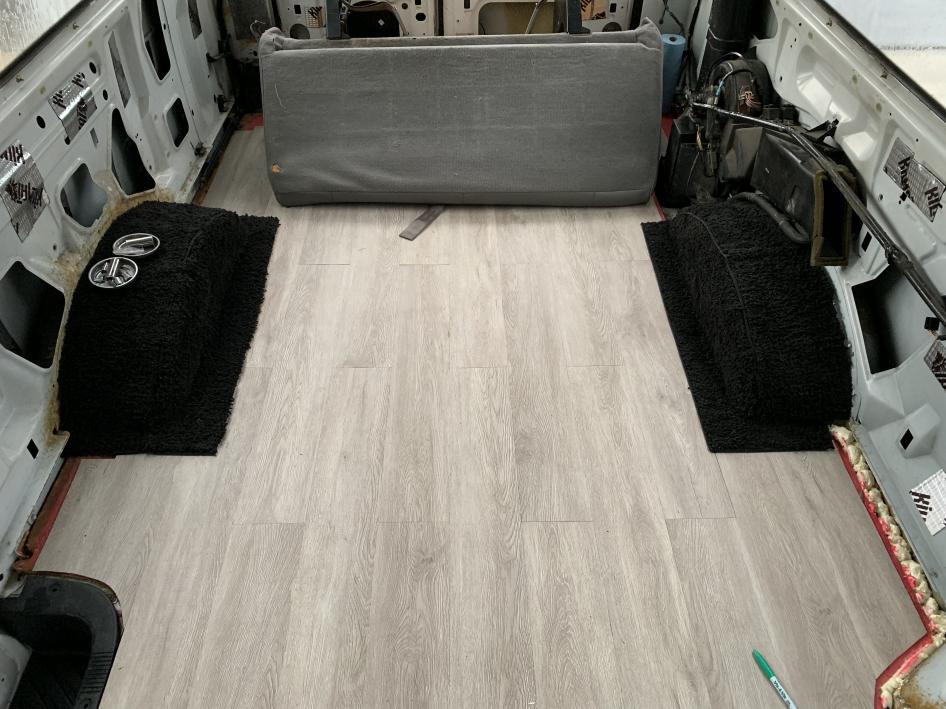 added vinyl flooring and carpeted the wheel wells