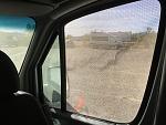 View through side window with mesh windshield screen