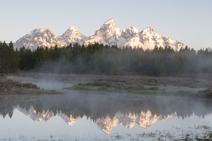 The Tetons reflected in a pond in Grand Teton National Park.
