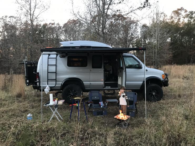 Liam camping on Papa's Farm in SC.