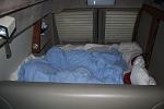 Bedding in Travel Mode - We just fold bedding over behind bench seat.