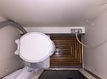 Teak shower mat with mounted Airhead composting toilet.  This fits very snugly so neither the toilet or the teak shower is going to be moving.